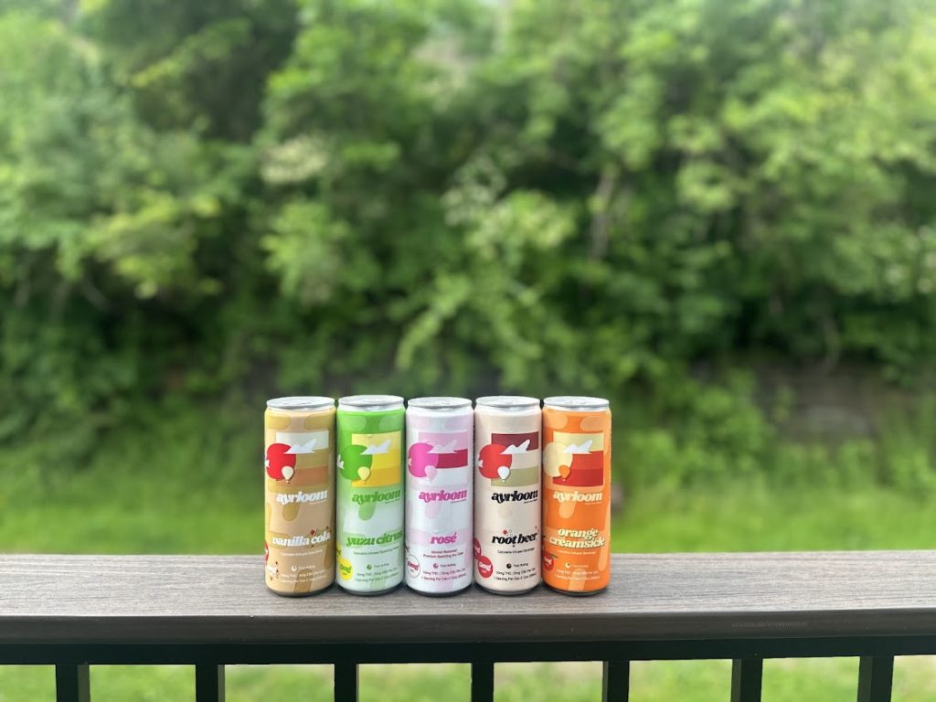 Cannabis beverages lined up on a sill. 